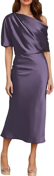 a woman wearing a purple dress with one shoulder draped over her shoulders and heels on the side