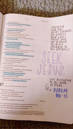 an open bible with the words seek jesus written in purple and blue ink on it