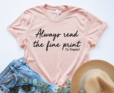 Pregnancy Announcement Shirt, Always read the fine print t-shirt. Our designs are made on super soft and lightweight t-shirts. We are proud to only use top quality fabric to insure softness and durability. All of our items are handmade in the U.S.A. We have been printing shirts since 2016 from our small shop please shop with confidence!  PROCESSING TIME: We offer fast processing times. Most orders ship out within 1-2 business days. Processing times are always accurately updated and posted and ca Maternity Cotton T-shirt With Graphic Print, Maternity Cotton T-shirt With Letter Print, Maternity Cotton Tops With Funny Print, Pink Cotton Maternity Top, Maternity Tops With Graphic Print And Relaxed Fit, Maternity Cotton T-shirt With Funny Text, Maternity Letter Print T-shirt For Summer, Maternity Summer T-shirt With Letter Print, Maternity Tops With Letter Print For Summer