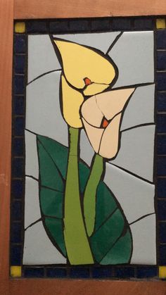 a stained glass window with a flower on it