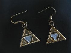 I've fabricated these unique sterling silver and 24K gold-plated Legend of Zelda inspired TriForce earrings. These are substantial and have some weight, though not so much to weigh down the earlobes. These are 1 inch in diameter and a lovely, unique keepsake for those who enjoy everything Zelda! Please feel free to convo if you have any questions and I'll answer quickly. Allow 3 days for fabrication prior to shipment. Thanks for looking! Gold Hand Cast Dangle Earrings, Artistic Gold Jewelry For Ceremonial Occasions, Symbolic Gold Sterling Silver Earrings, Gold Symbolic Jewelry With Earrings Set, Ceremonial Gold Sterling Silver Earrings, Triforce Earrings, Zelda Earrings, Felt Bag, Moon Pendant