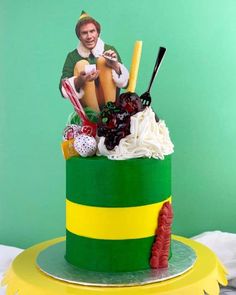 a green and yellow striped cake with an image of a man holding a baseball bat