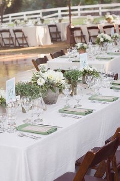 the tables are set with place settings for dinner