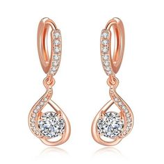 These casual occasion drop earrings come with high-class cubic zirconia work and are crafted of durable copper metal to add durability and a little sparkle that catches the light. Crafted with a fabulous rose gold color shade and a spiral design, these drop earrings add elegance, and are a perfect choice for daily wear. Specifications Earring Type: Drop EarringsItem Type: EarringsFine or Fashion: FashionBrand Name: GeraldBlackStyle: ClassicGender: WomenShape\pattern: GeometricMaterial: MetalMeta Spiral Design, Cubic Zirconia Earrings, Copper Metal, Crystal Drop Earrings, Crystal Drop, Engagement Jewelry, Austrian Crystal, Rose Gold Color, Color Shades