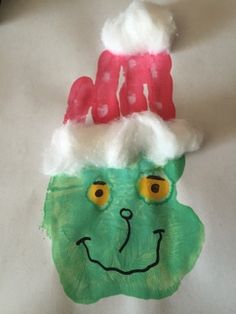 a close up of a paper mache wearing a santa hat