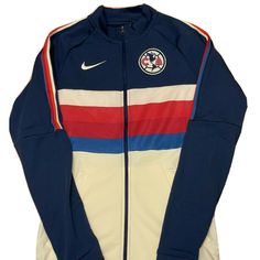 the nike paris saint - germaine track jacket is blue, white, and red