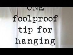 the words one foolproof tip for hanging are displayed in front of a window with white curtains