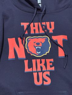 Represent Morgan State in style with this exclusive "They Not Like Us" shirt, featuring the iconic Morgan Bear.  Homecoming at an HBCU is a time-honored tradition, and this shirt is perfect for showing your school pride.  Whether you are a current student, alumnus or a proud supporter, this t-shirt is a must have for the festivities. These unisex shirts are made from premium-quality soft cotton.  The bold design stands out, making it a perfect choice for game day, tailgating, and alumni events. Morgan State Homecoming Outfit, Team Spirit Tops With Lettering For Fan Merchandise, Fan Merchandise Tops With Lettering, Fan Merchandise Lettering Tops, State Team Shirt, Men’s School Spirit Shirts, Morgan State University, Michigan State Hoodie, Alumni Events