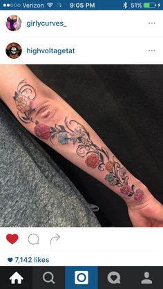 a woman's arm with flowers on it and the words girlycurvez high voltagetat