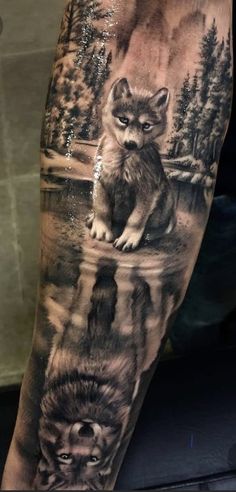 a man's arm with an image of animals on the water and trees in the background