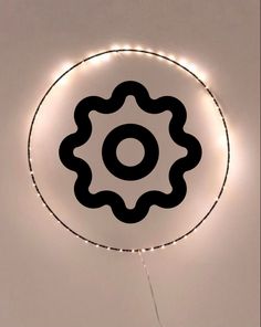 a black and white circle with lights around it