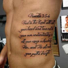 the back of a man's stomach with an inscription on it that says,