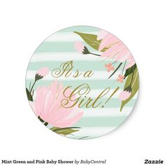 a round sticker that says as a girl with pink flowers and leaves on it