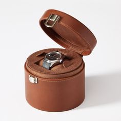 For that one spectacular timepiece that deserves its own spot, this dresser-top watch box will keep it safe and protected. The top comes out to reveal space for cufflinks or other small items. Wrapped in a durable and soft faux leather, the design is finished with a laser engraved on the lid.    5.25"w x 5"d x 4.25"h  MDF, polyurethane leather, sueded polyester interior, nickel hardware.  Clean with a soft, damp cloth.  Imported.  Monogramming is laser engraved. Leather Engraved, Leather Engraving, Dresser Top, Engraved Box, Leather Box, Nickel Hardware, Top Round, Watch Box, School Days