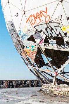 a large white structure with graffiti on it's sides and the word tony written in black