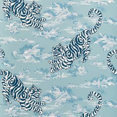 a blue and white tiger print wallpaper with clouds in the sky, on a light blue background