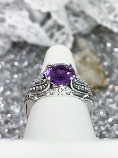 "Natural Purple Amethyst Ring Small Oval Gothic Design#85 Custom made This is a brand new stunning Gothic/Renaissance inspired sterling silver filigree ring. The flawless oval-cut high-quality natural purple amethyst is 11mm (7/16th of an inch) by 9mm (just shy of 3/8\" inch) in dimension... The inside of the band is marked 925 for sterling. Notice the beautiful filigree swirl like the craftsmanship of the silver setting. This is an exquisite rendition of a Gothic design filigree ring.... and is Amethyst Topaz Ring With Accent Stones, Topaz Ring With Amethyst And Accent Stones, Purple Topaz Ring With Accent Stones, Amethyst Rings With Vs Clarity, Gothic Filigree, Mystic Fire Topaz, Purple Amethyst Ring, Gothic Design, Amethyst Gem