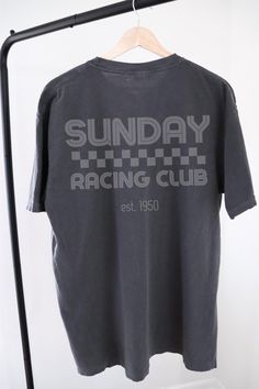 Welcome to Grand Prix Fanatics! Whether you are an F1 fanatic or just want to represent your favorite sport, you can be sure to make a statement with these unique Formula 1 racing inspired tees. Trendy racing apparel that is of good quality at an affordable price. This Comfort Colors "Sunday Racing Club" unisex t-shirt is made from 100% ring-spun cotton, offering the ultimate comfort with a relaxed fit. It's available in colors Pepper or Grey and the design is intended to look faded. The medium weight fabric is soft-washed and garment-dyed to ensure a cozy feel, while the double-needle stitching throughout the tee ensures its durability. The graphic is high-quality screen printed to be durable and long-lasting! If you have any questions, please don't hesitate to get in touch. I appreciate Affordable Faded Graphic Tee, Casual T-shirt With Letter Print For Motorsport Events, Racing Style Cotton T-shirt With Letter Print, Racing Style Letter Print T-shirt For Motorsport Events, Racing Style T-shirt With Letter Print For Motorsport Events, Racing Style Tops For Motorsport Events, Racing Style T-shirt For Motorsport Events, Sporty Tops With Letter Print For Motorsport Events, Fall Drive