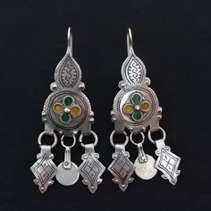 Handmade from southern Morocco- lakhssas. Very old and beautiful earrings with enamel and niello. The ear pin is suitable for the ear. In good condition and fast shipping. *weight: 24.4 gram *length and width: 9.6 cm / 3 cm If there is any other question sand me a message and i will be very happy to answer it as son as possible. Visit my store: https://www.etsy.com/fr/shop/Berberjewelery Bohemian Meenakari Earrings For Ceremonial Occasions, Traditional Green Filigree Earrings, Traditional Filigree Pendant Earrings, Traditional Silver Filigree Danglers, Ceremonial Silver Meenakari Earrings, Silver Meenakari Earrings For Festivals, Berber Jewelry, Ear Pin, Ear Pins