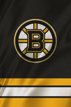 the boston hockey team jersey is shown in black and yellow stripes with an emblem on it