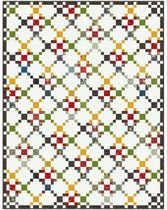 a white quilt with multicolored squares on the top and bottom, in different colors