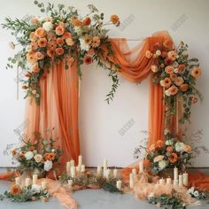 an orange wedding arch with candles and flowers