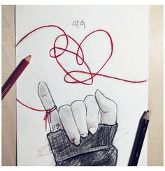 a drawing of a hand holding a knife with the word love written on it and a red heart in the background