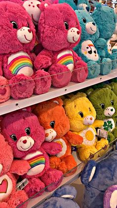 there are many stuffed animals on the shelves in this store, all different colors and sizes