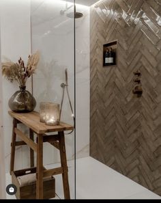 a wooden table sitting next to a shower in a bathroom