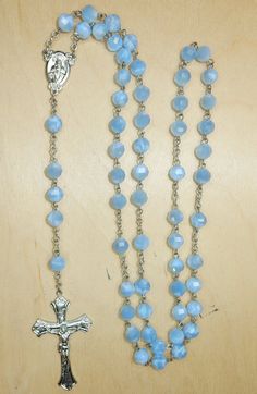 Beautiful vintage glass beads rosary. Good vintage condition. Metal components have oxidation. Length: 48 cm Cross: 46 mm / 26 mm Bead: 7 mm / 6 mm Czechoslovakia / Jablonec nad Nisou / 1930  If you have any questions, do not hesitate to contact me. :) Blue Crucifix Necklace For Spiritual Wear, Blue Crucifix Necklace For Spiritual Purposes, Blue Rosary With 8mm Beads And Crucifix, Blue Rosary With 8mm Beads In Cross Shape, Healing Rosary With Miraculous Medal And Round Beads, Healing Rosary With Miraculous Medal, Blue Rosary With Round Beads For Healing, Blue Rosary With 8mm Beads For Healing, Blue Spiritual Rosary With Gemstone Beads