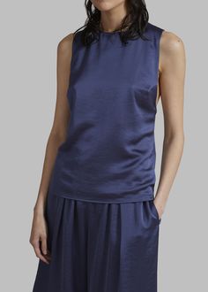 Color: Nightshadow Blue Lightweight fluid fabric with slight sheen Relaxed fit Round neckline Sleeveless Covered button closure on one shoulder Straight hem Twisted back detail Slip-on style Unlined 64% Viscose (LENZING™ ECOVERO™) 36% Polyester Gentle Machine Wash By Samsøe Samsøe. Imported Frankie Shop, Back Details, Samsoe Samsoe, Clothes Shop, Round Neckline, Latest Fashion Trends, One Shoulder, Slip On, Twist