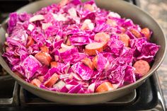 red cabbage and carrots in a pan on the stove