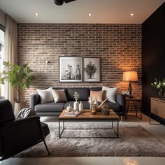 a modern living room with brick walls and grey couches in front of a coffee table