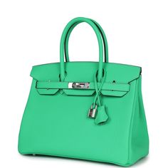 This Birkin is in Vert Comics togo leather with palladium hardware and has tonal stitching, front flap, two straps with center toggle closure, clochette with lock and two keys, and double rolled handles.The interior is lined with Vert Comics chevre and has one zip pocket with an Hermes engraved zipper pull and an open pocket on the opposite side.Collection: WOrigin: FranceCondition: New and never worn (plastic on hardware)Accompanied by: Hermes box, Hermes dustbag, clochette, lock, two keys, clochette dustbag, felt, carebook, ribbon Measurements: 11.75" width x 9.5" height x 6" depth; 4.25" handle drop Togo Leather Bags With Silver-tone Hardware, Modern Togo Leather Travel Bag, Modern Togo Leather Bag With Silver-tone Hardware, Birkin 30, Hermes Birkin 25, Hermes Birkin 30, Togo Leather, Hermes Box, Random Ideas