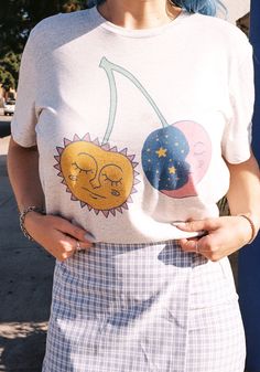 These sun and moon cherries are ripe and ready to be plucked from the heavens. Hand drawn design with vibrant colors and celestial sweetness. Printed on a unisex tee in White Fleck Triblend. 50% Polyester, 25% Cotton, 25% Rayon. Model wears size Medium. Moon Shirts, Womens Graphic Tees, Moon Shirt, The Heavens, Hand Drawn Design, Sun And Moon, Graphic Tees Women, Hand Drawn, Solar