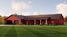 a large red barn with a black roof and two garages on the side of it