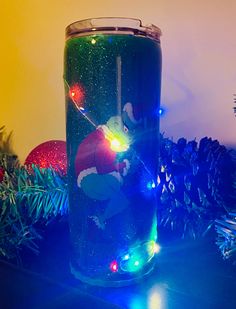 20oz tumbler with real working Christmas lights. Battery pack is contained in compartment in bottom of cup. Customization available. Hand wash only. Grinch Tumbler Cups, Grinch Drinkware Plastic, Grinch Glass Tumblers, Cup Customization, Grinch Christmas Lights, Bottom Of The Bottle, Custom Favor, Grinch Christmas, Water Glasses