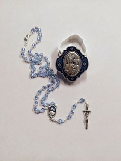 Rosary of Our Lady of Good Health in half blue crystal, rosary length cm 40 (15.74 inches) equipped with hook to wear it. Handcrafted in Italy, complete with deluxe metal case with image of the Madonna della Buona Salute on the lid. Handmade by expert craftsmen in the sector with top-notch materials and quality. For an excellent success of the delivery we ask you to leave a telephone number to be delivered to the courier. The online sale of sacred statues, icons, silverware, religious items and Adjustable Blue Rosary With Miraculous Medal, Our Lady Of Good Health, Crystal Rosary, The Madonna, Telephone Number, Good Health, Online Sale, Our Lady, Blue Crystals