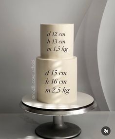 a three tiered cake on a plate with measurements printed on the top and bottom