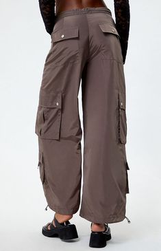 Unleash your free-spirited style with the PacSun Wide Leg Baggy Pants. These effortlessly chic pants offer a comfortable fit and breezy wide legs, perfect for adding a laid-back yet trendy vibe to your everyday look. it gets finished off with zipper side hand pockets, roomy cargo pockets, D-loop details, and drawcord ankle cuffs for a customizable fit. 


	11" rise
	29" inseam
	Solid color pants
	Adjust the rise with the drawcord
	Goes from low-rise to high-rise
	Zipper side pocke Color Pants, Chic Pants, Free Spirit Style, Solid Color Pants, Trouser Pants Women, Baggy Pants, Baggy Pant, Ankle Cuffs, Wide Legs