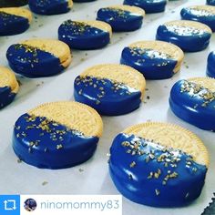 cookies with blue icing and gold sprinkles