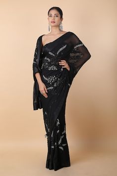 Black saree with contrasting and tonal floral embroidery. Comes with unstitched blouse piece. - Aza Fashions Embroidered Saree For Evening, Elegant Evening Saree With Floral Embroidery, Elegant Floral Embroidered Saree For Evening, Elegant Floral Embroidered Evening Saree, Evening Saree With Floral Embroidery, Formal Black Embroidered Saree, Evening Georgette Pre-draped Saree With Floral Embroidery, Floral Embroidered Saree Sets For Evening, Evening Pre-draped Georgette Saree With Floral Embroidery