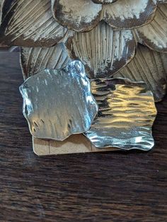 an owl figurine sitting on top of a wooden table