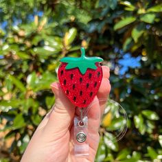 "Strawberry Glitter Interchangeable Badge Reel This Strawberry Glitter Badge Reel is a perfect for any Healthcare worker, or anyone who uses a badge, but uses a plain old boring badge reel! The Strawberry Badge Reel is interchangeable so you can switch them out for another cute charm any time you want. This adorable Strawberry has a red glitter backing to add some sparkle to anyones work attire! The Strawberry Badge Reel is a great gift for a medical worker or even a graduation gift for a future medical professional. The Strawberry Badge Reel would also be a great gift for anyone who needs to wear a badge like teachers, healthcare worker, even students! It adds a cute touch to any scrub top, work shirt or blouse, shirt pocket, and more!  Strawberry Badge Charm can be attached to two differ Black Lanyard, Badge Lanyard, Strawberry Print, Loose Outfit, Cute Charms, Clear Vinyl, Red Glitter, Id Holder, Badge Holders Lanyard