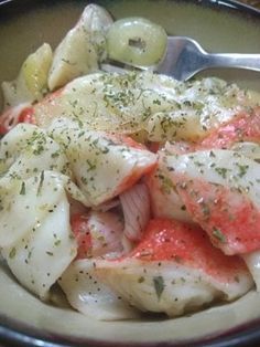 a close up of a plate of food with fish