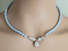 Wedding Light Blue Blush Blue Pearl Silver Choker Bridal Necklace. NECKLACE is about 18 inches (45.7cm) long. BACKDROP is about 4 inches (10.1cm). JEWELRY SETS SECTION: https://www.etsy.com/shop/LanaChayka?ref=seller-platform-mcnav§ion_id=18873488 BRIDAL JEWELRY SETS SECTION: https://www.etsy.com/shop/LanaChayka?ref=seller-platform-mcnav§ion_id=25839214 BRIDAL NECKLACES SECTION: https://www.etsy.com/shop/LanaChayka?ref=seller-platform-mcnav§ion_id=11638944 Elegant and classy, this stunning neckl Light Blue Crystal Jewelry For Wedding, Light Blue Crystal Wedding Jewelry, Elegant Light Blue Necklace For Wedding, Elegant Light Blue Wedding Necklaces, Blue Pearl Necklace, Pearl Wedding Necklace, Statement Necklace Wedding, Bridal Necklaces, Light Blue Wedding