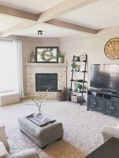 a living room filled with furniture and a flat screen tv