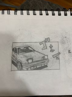 a drawing of a car is shown on a piece of paper