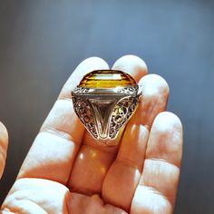 A ring that is big, bold and fancy. It`s name says it all... Eye-catcher!Designed and handcrafted by Turkish artisan jewelers.Quality meets perfection!Bold & ChunkyMETAL : .925 Sterling SilverSTONE: natural Citrine (origin: India)STONE DIMENSIONS: 30 x 22 mmSIZE: US 13*for resizing please get in touch after order•Hypoallergenic•Lead & Nickel free Luxury Polished Topaz Ring For Gift, Luxury Gift Topaz Ring With Polished Finish, Handmade Luxury Crystal Ring For Formal Occasions, Luxury Handmade Amber Rings, Luxury Handmade Yellow Rings, Handmade Gold Topaz Ring In Sterling Silver, Unique Citrine Rings With Polished Finish, Unique Citrine Ring With Polished Finish, Collectible Citrine Ring Jewelry