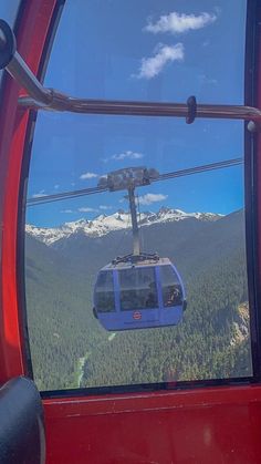 a gondola car is seen in the reflection of another vehicle